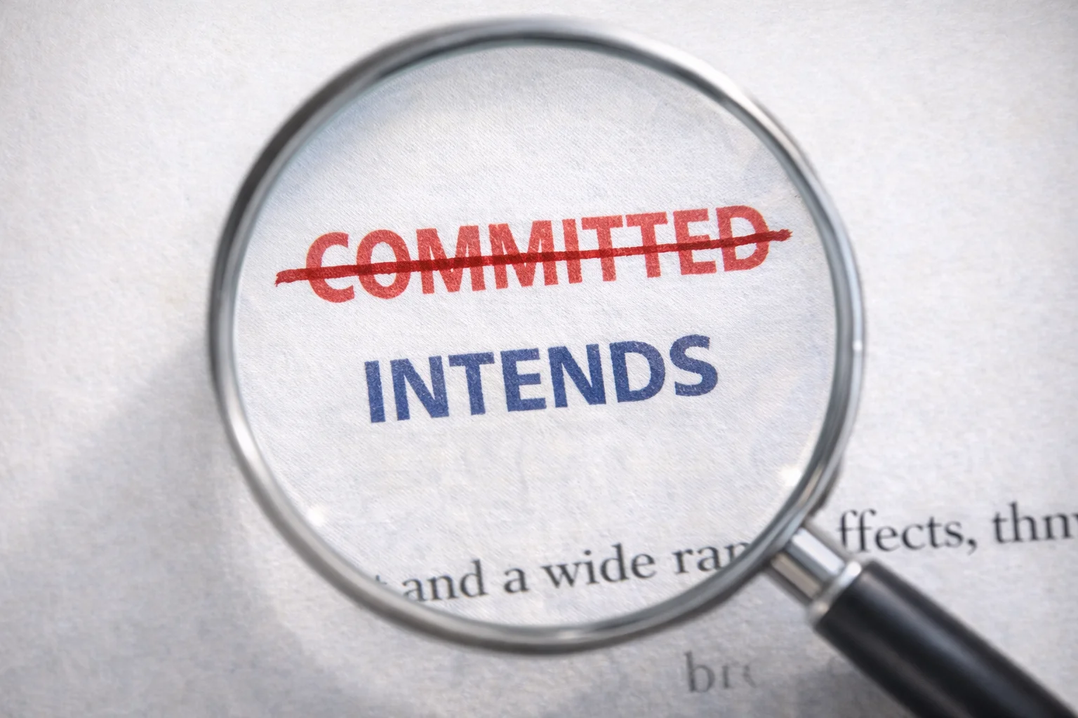 US India trade deal controversy document close up showing commitment crossed out and replaced with intends